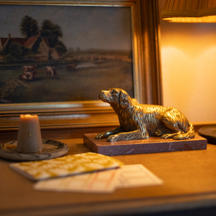 A 19th Century Gilt Bronze Study of a Reclining Labrador Dog on a Rouge Marble Base