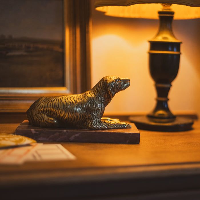 A 19th Century Gilt Bronze Study of a Reclining Labrador Dog on a Rouge Marble Base