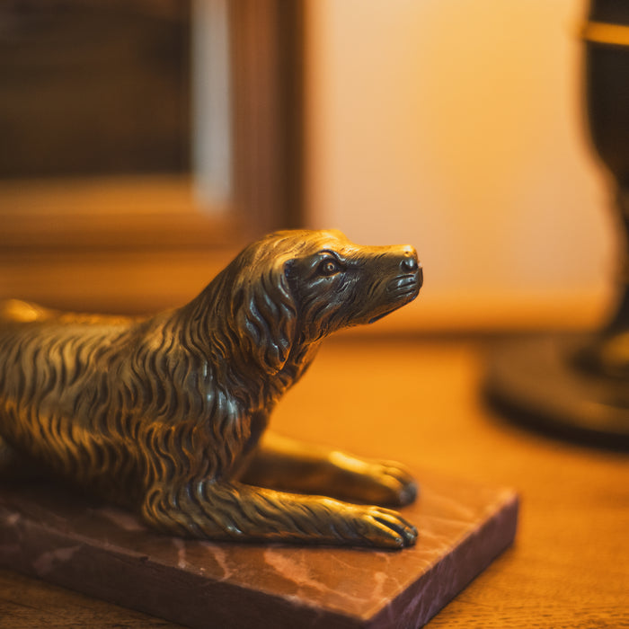 A 19th Century Gilt Bronze Study of a Reclining Labrador Dog on a Rouge Marble Base