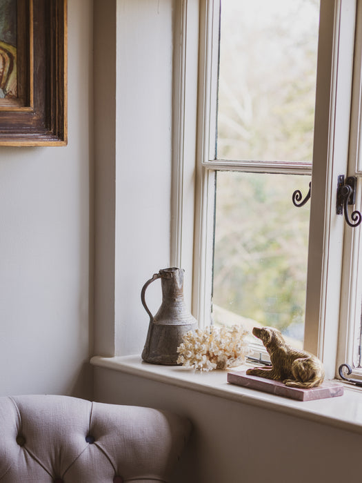 A 19th Century Gilt Bronze Study of a Reclining Labrador Dog on a Rouge Marble Base