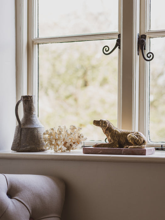 A 19th Century Gilt Bronze Study of a Reclining Labrador Dog on a Rouge Marble Base