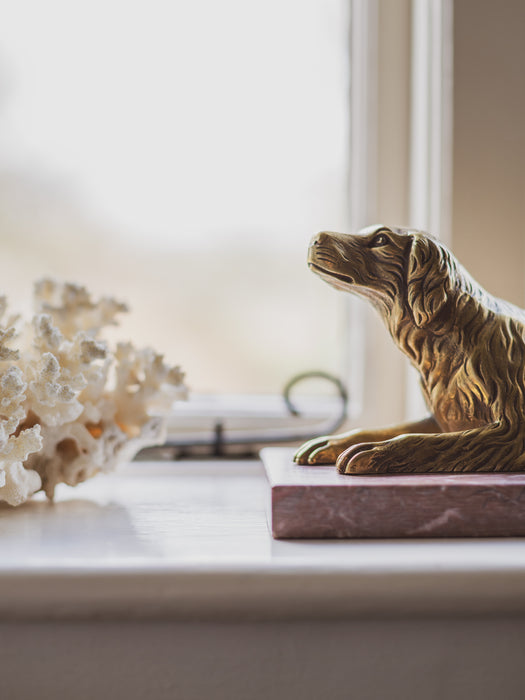 A 19th Century Gilt Bronze Study of a Reclining Labrador Dog on a Rouge Marble Base