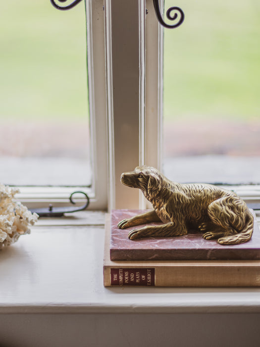 A 19th Century Gilt Bronze Study of a Reclining Labrador Dog on a Rouge Marble Base