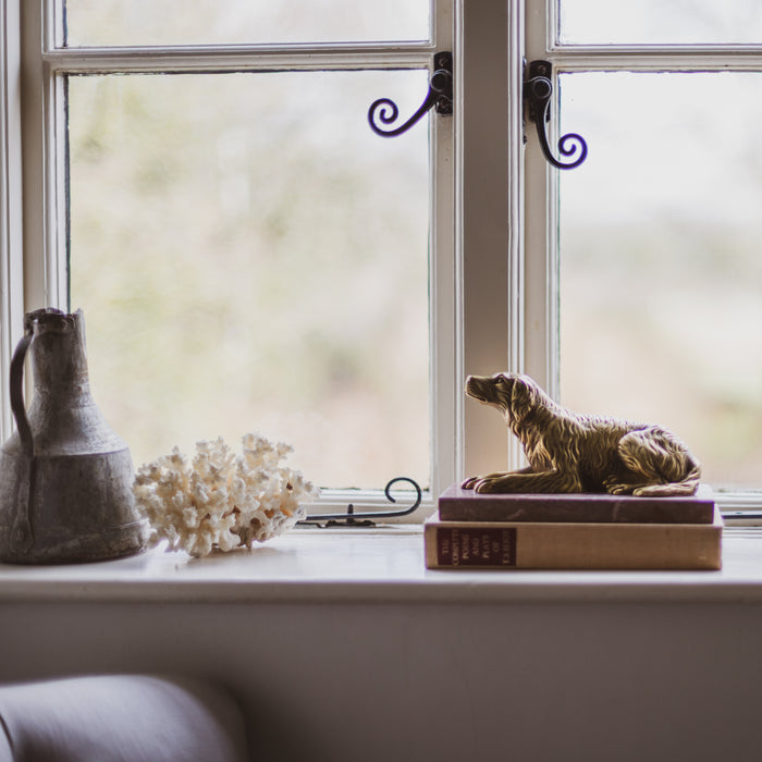 A 19th Century Gilt Bronze Study of a Reclining Labrador Dog on a Rouge Marble Base